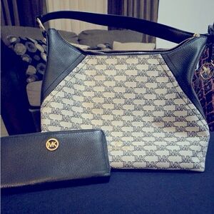 Black and beige Michael Kors bag with solid black wallet